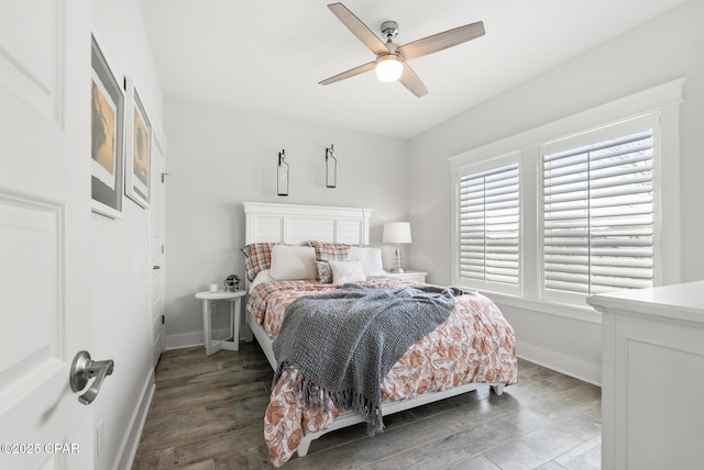 bedroom featuring ceiling fan and dark hardwood / wood-style flooring