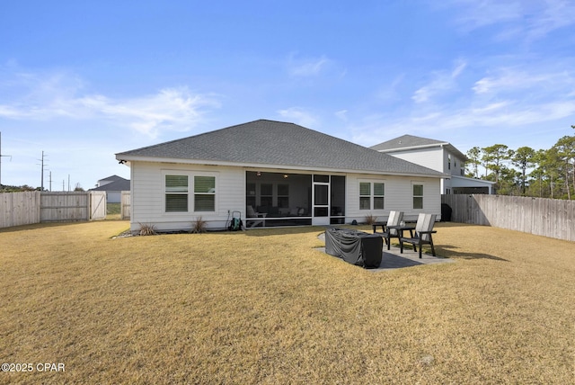 back of house with a sunroom, a yard, and a patio area