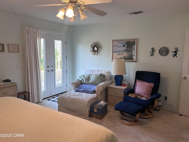 carpeted bedroom with french doors, access to exterior, a ceiling fan, and visible vents