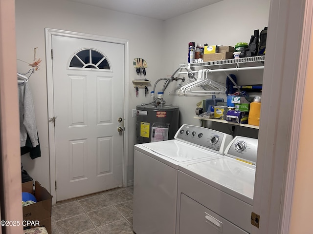laundry area with independent washer and dryer, laundry area, electric water heater, and tile patterned floors