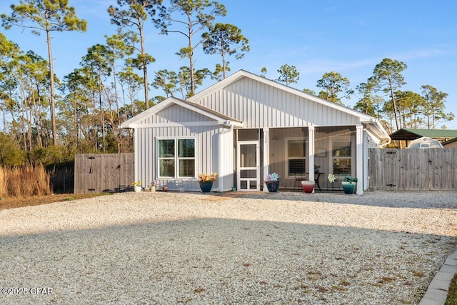 132 Gulf Terrace Ln, Port St Joe, FL 32456 - back of house with a gate, a sunroom, and fence