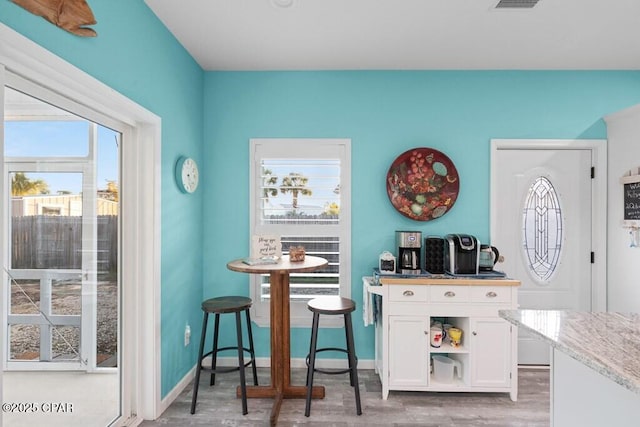 132 Gulf Terrace Ln, Port St Joe, FL 32456 - bar area with light wood-type flooring and baseboards