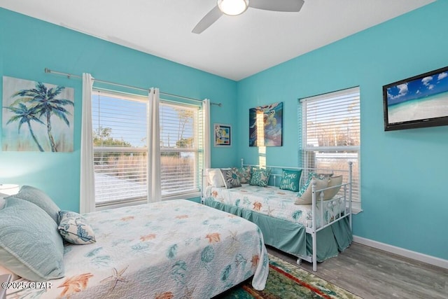 132 Gulf Terrace Ln, Port St Joe, FL 32456 - bedroom with wood finished floors, baseboards, and ceiling fan