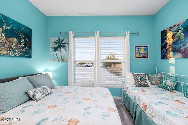 132 Gulf Terrace Ln, Port St Joe, FL 32456 - bedroom with dark wood-style floors and baseboards