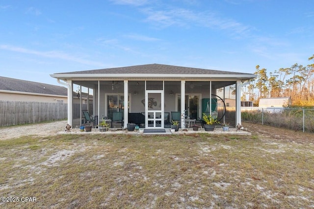 132 Gulf Terrace Ln, Port St Joe, FL 32456 - back of house featuring a sunroom and a fenced backyard