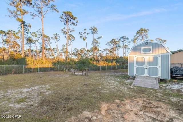 132 Gulf Terrace Ln, Port St Joe, FL 32456 - fenced backyard with a storage unit and an outdoor structure