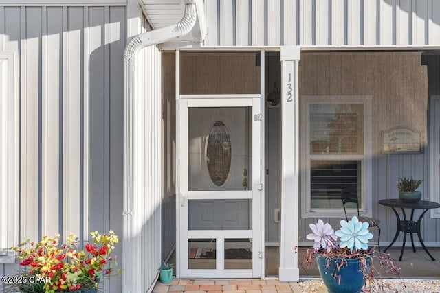132 Gulf Terrace Ln, Port St Joe, FL 32456 - view of exterior entry with board and batten siding and a porch