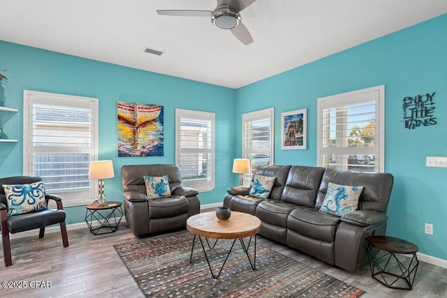 132 Gulf Terrace Ln, Port St Joe, FL 32456 - living room with wood finished floors, baseboards, and healthy amount of natural light