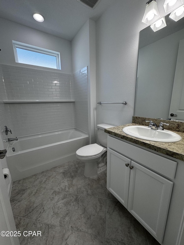 bathroom with toilet, vanity, shower / tub combination, and visible vents