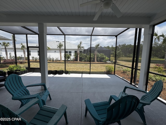 sunroom with a ceiling fan