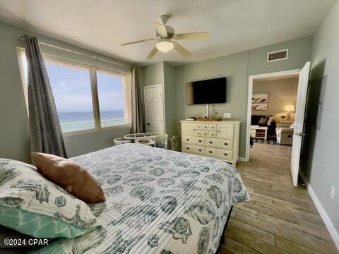bedroom with hardwood / wood-style flooring and ceiling fan