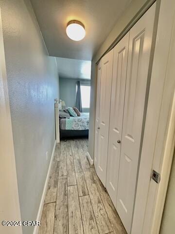 hall with light wood-type flooring