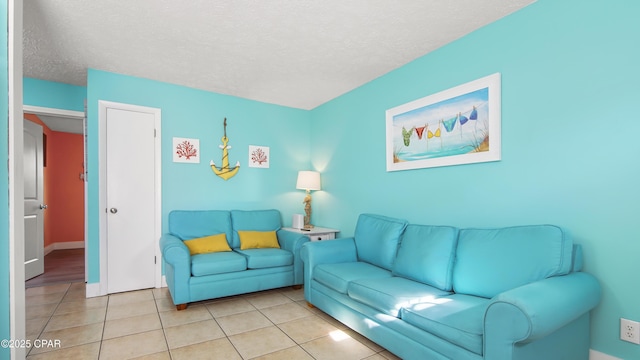 tiled living room featuring a textured ceiling