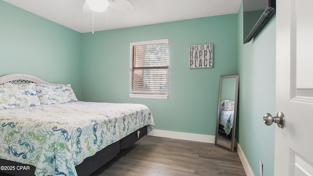 bedroom with ceiling fan and hardwood / wood-style floors