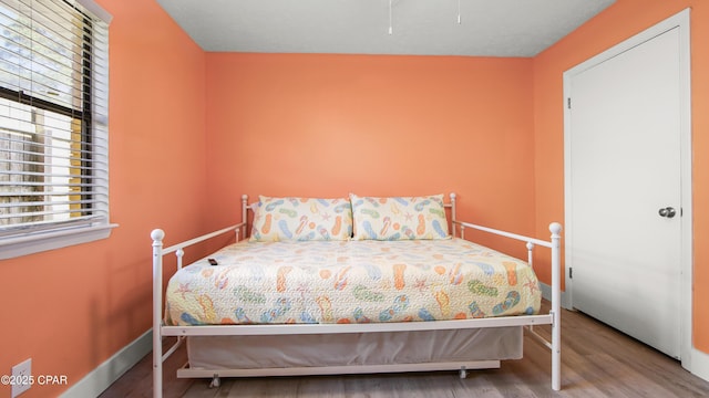 bedroom featuring hardwood / wood-style flooring