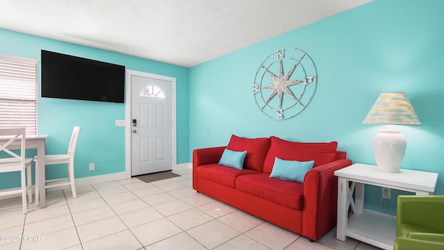 tiled living room with a textured ceiling