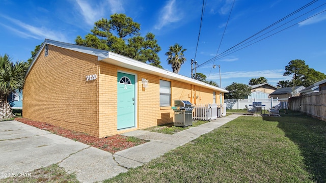 view of home's exterior featuring a yard