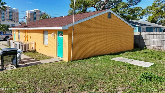 view of home's exterior featuring a yard