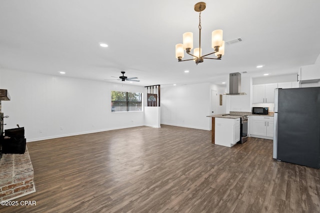 kitchen with island exhaust hood, white cabinetry, stainless steel appliances, dark hardwood / wood-style flooring, and hanging light fixtures