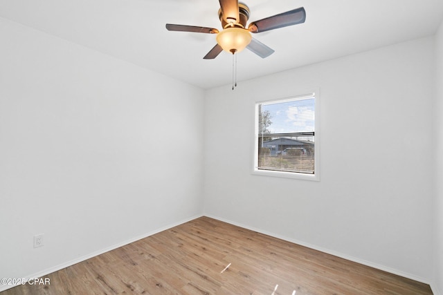 spare room featuring ceiling fan and light wood-type flooring