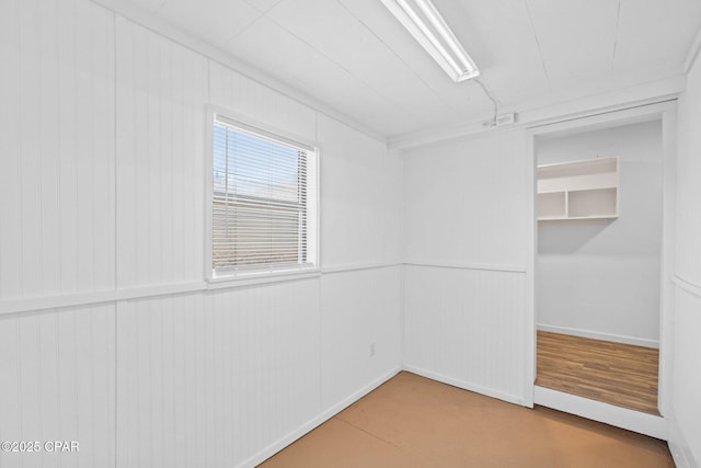 unfurnished bedroom with concrete floors