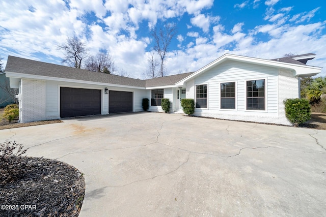 ranch-style house featuring a garage