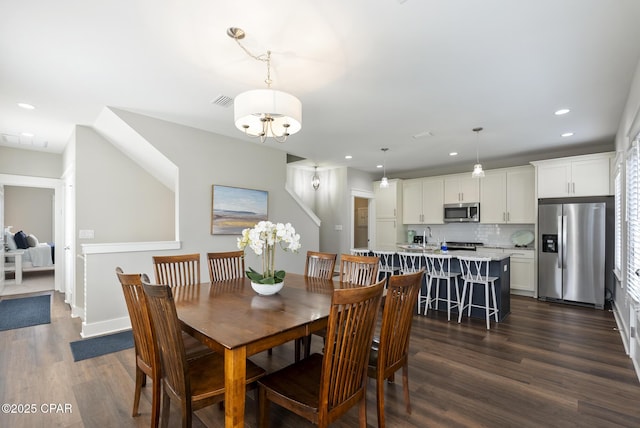 dining space featuring dark hardwood / wood-style flooring