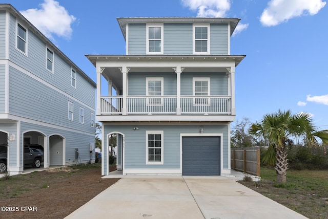 view of front facade featuring a balcony and a garage