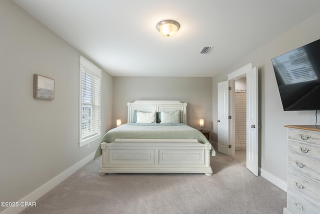 bedroom featuring light colored carpet