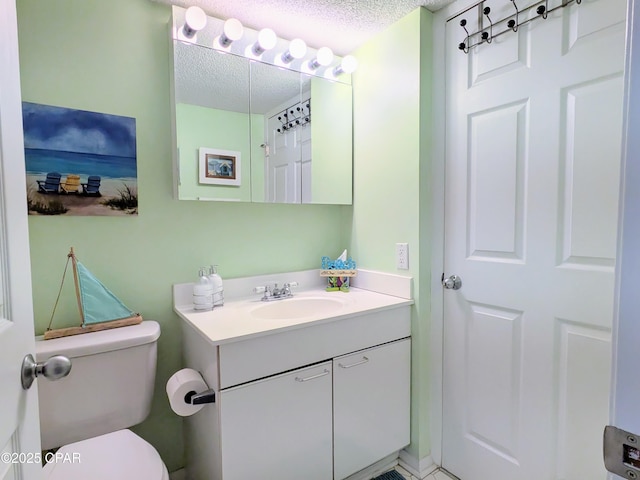 half bathroom with toilet, a textured ceiling, and vanity