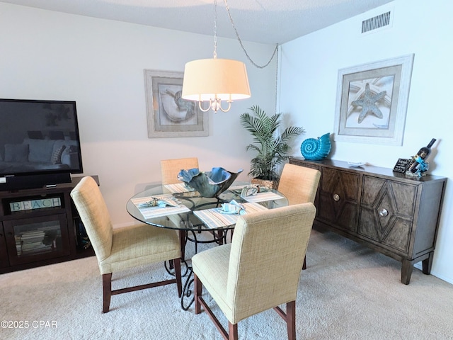 dining space featuring carpet and visible vents