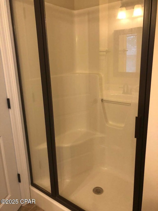 bathroom featuring an enclosed shower