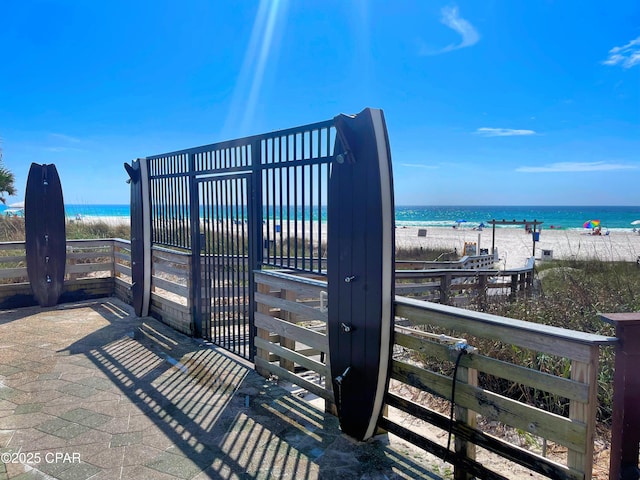 11757 Front Beach Rd Unit L104, Panama City Beach, FL 32407 - view of gate with a water view and a beach view