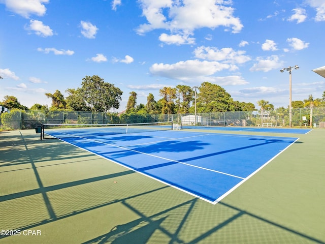 view of sport court with fence