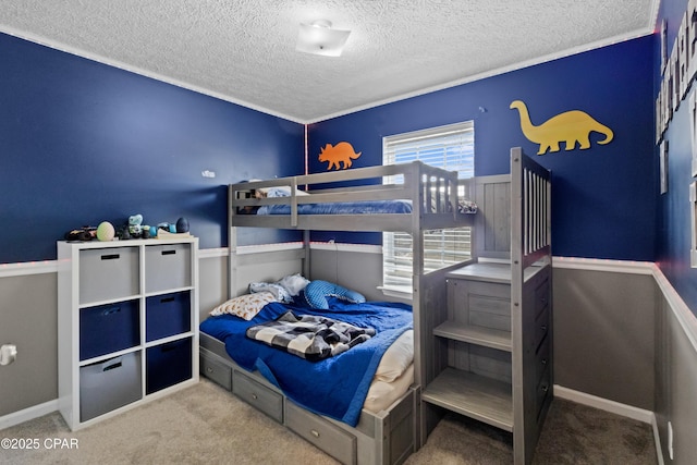 bedroom with carpet and a textured ceiling