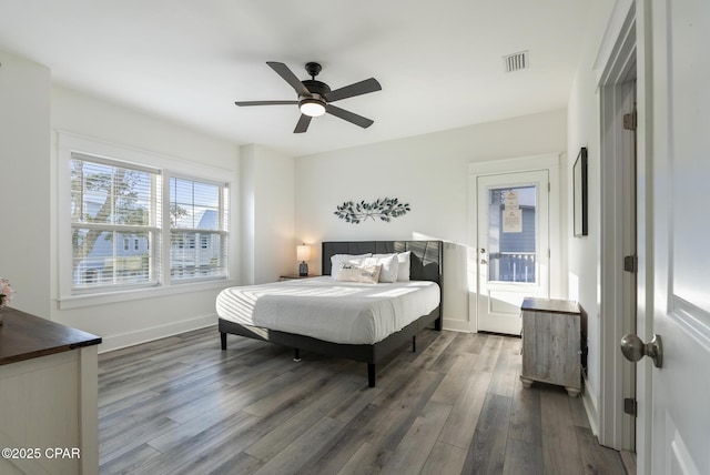 bedroom featuring dark hardwood / wood-style floors and ceiling fan