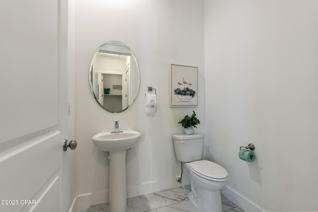 bathroom featuring toilet