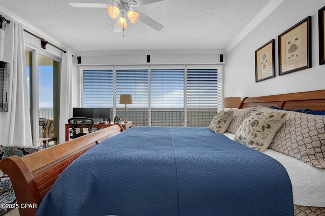 9450 S Thomas Dr Unit 802C, Panama City, FL 32408 - carpeted bedroom featuring ornamental molding, a textured ceiling, access to outside, and a ceiling fan