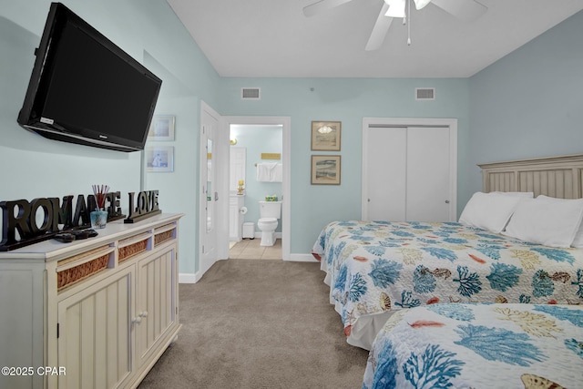 9450 S Thomas Dr Unit 802C, Panama City, FL 32408 - bedroom featuring light colored carpet, a closet, ceiling fan, and ensuite bath