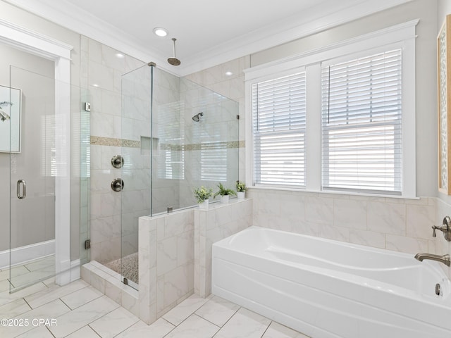 full bath featuring crown molding, a shower stall, and a garden tub