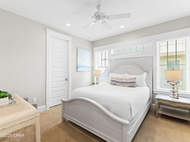 carpeted bedroom featuring baseboards, ceiling fan, and recessed lighting