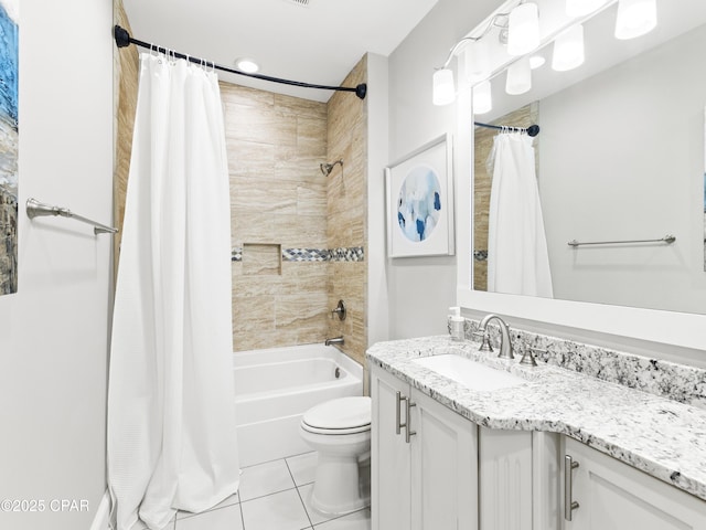 full bath featuring toilet, tile patterned floors, shower / tub combo, and vanity