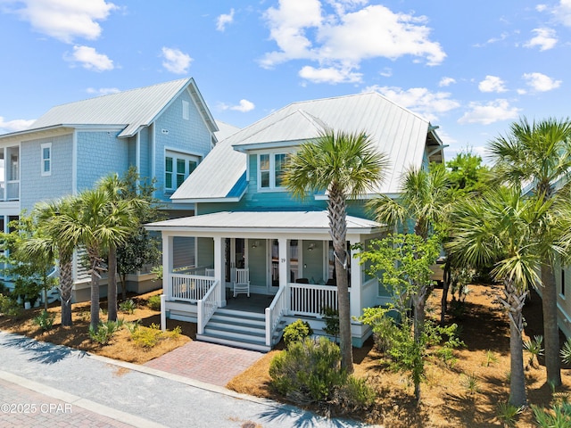 view of front of property featuring covered porch and metal roof