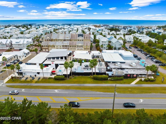 birds eye view of property with a water view and a residential view
