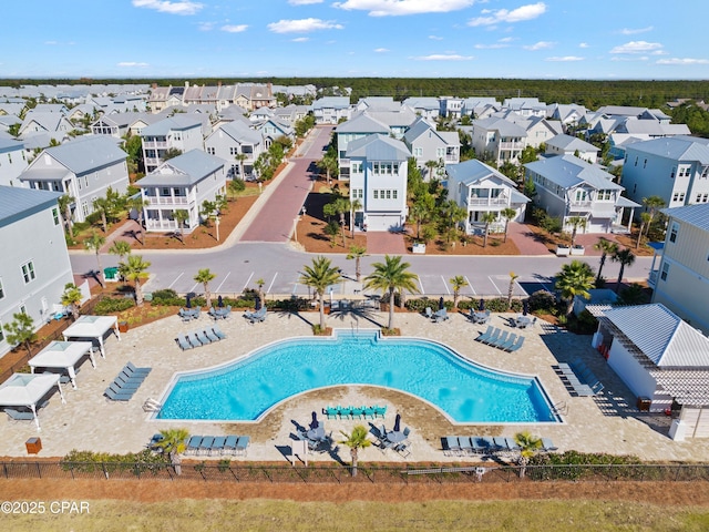 birds eye view of property with a residential view