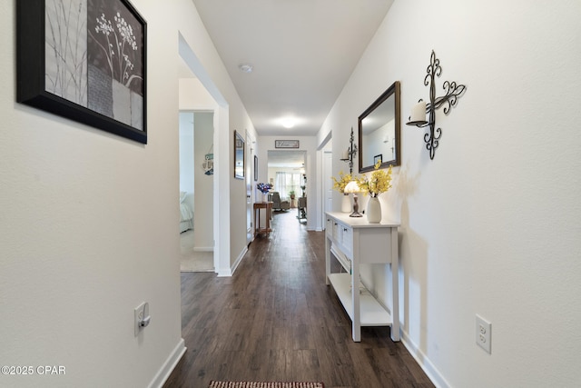 hall with dark hardwood / wood-style floors