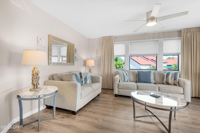 8730 Thomas Dr Unit 1211C, Panama City Beach, FL 32408 - living room with baseboards, wood finished floors, and ceiling fan