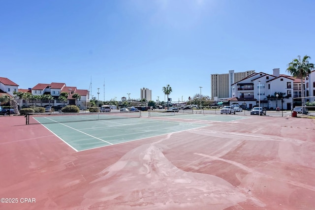 view of sport court with fence