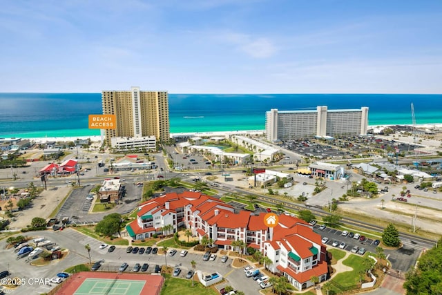 aerial view with a view of the beach, a view of city, and a water view