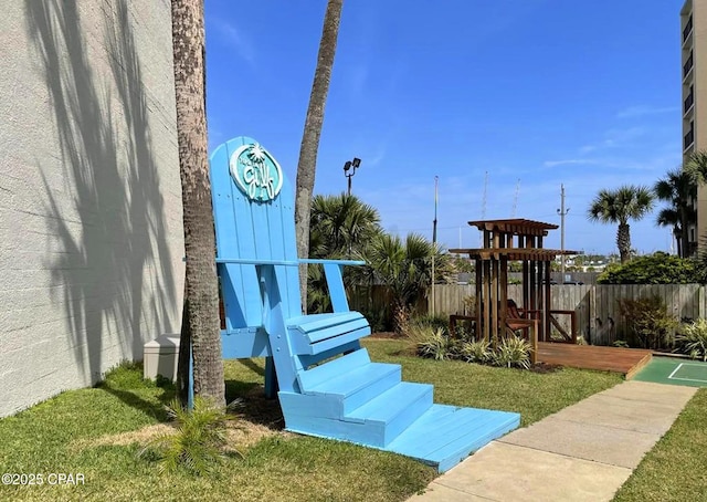 view of jungle gym featuring a lawn